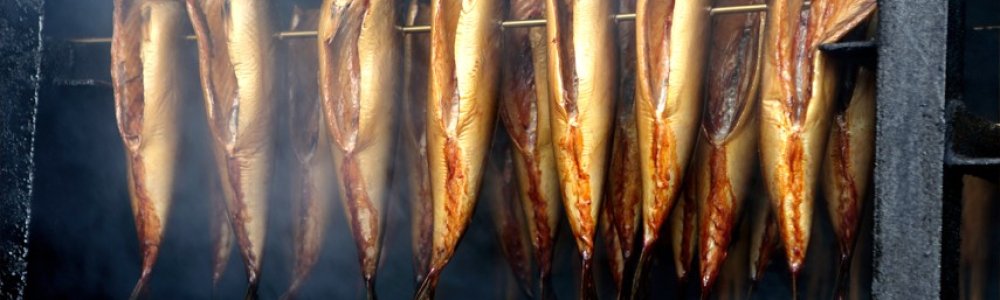 A garden smokehouse is the place to prepare not only meat or fish